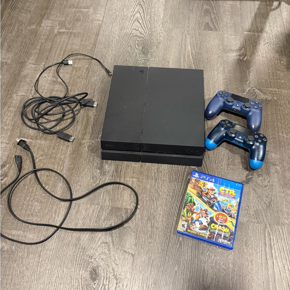 Sony PS4 with two controllers and a game